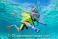 Child snorkel diving on the Great Barrier Reef. Photo taken at Heron Island, Great Barrier Reef, Queensland, Australia.