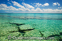 Tropical seascape comprising coral reef rock adjacent to shore. Cocos (Keeling) Islands, Indian Ocean, Australia