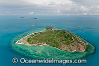 Aerial view of un-inhabited Mount Ernest Island (also known as Naghir and Naga, Nagir Island), with Burke Island and Pole Island in distant background. Torres Strait, Queensland, Australia