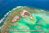 Aerial view of One Tree Island and reef lagoon, with Research Station visible. One Tree Island is a small coral cay located near the Tropic of Capricorn in the southern Great Barrier Reef, Australia, and part of the Capricorn group of Islands.