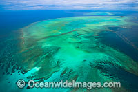Aerial view of Heron Island and reef, with Wistari Reef visible in background. Heron Island is a small coral cay located near the Tropic of Capricorn in the southern Great Barrier Reef, Australia, and part of the Capricorn group of Islands.
