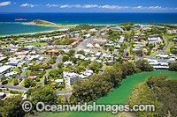 Aerial view of Coffs Harbour, situated on the northern New South Wales coast, showing residential jetty area with Coffs Creek lined with mangrove trees in foreground. Coffs Harbour, Australia.