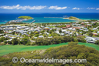 Aerial view of Coffs Harbour, situated on the northern New South Wales coast, showing protected boat harbour, Mutton Bird Island, residential jetty area and Coffs Creek lined with mangrove trees in foreground. Coffs Harbour, Australia.