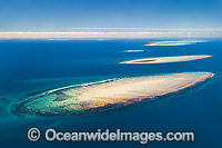 Aerial view of Polmaise Reef, Masthead Island Reef, Erskine Island Reef, Wistari Reef, Heron Island Reef and Sykes Reef (showing from foreground to distant background). Capricorn Group, southern Great Barrier Reef, Qld, Australia.