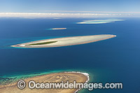 Aerial view of Polmaise Reef, Masthead Island Reef, Erskine Island Reef, Wistari Reef, Heron Island Reef and Sykes Reef (showing from foreground to distant background). Capricorn Group, southern Great Barrier Reef, Qld, Australia.