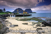 Supply ship unloads goods onto the Lord Howe Island jetty. Lord Howe Island, World Heritage National Park, New South Wales, Australia.