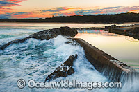 Sawtell Rock Pool at sunset. A favourite natural rock swimming pool open to the general public. Sawtell, New South Wales, Australia.