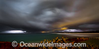 Storm passing over Sawtell Rock Pool and Bonville Beach during early evening. Sawtell, New South Wales, Australia.