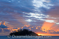 Seascape comprising tropical island and sunset. Whitsunday Islands, Queensland, Australia