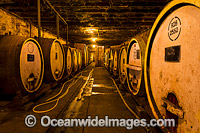 French Oak wine barrels in underground wine cellar, Tahbilk Winery, Nagambie, country Victoria, Australia.
