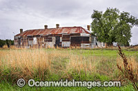 The former Duckholes Hotel at Monegeetta North, now clad in rusty roofing iron. The weatherboards were removed and the structure re-clad with this unusual collection of corrugated iron between 1968 and 1976. Situated near Romsey, Victoria, Australia.