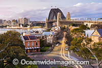 Sydney Harbour Bridge, Luna Park and City during dusk. Sydney, New South Wales, Australia.