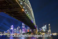 Sydney city and Harbour Bridge decorated in projected light during the Vivid Sydney 2023 festival of light, music and ideas. Sydney, New South Wales, Australia.