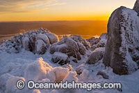 Sunrise at Mount Wellington summit, cloaked in winter snow. Near Hobart, Tasmania, Australia.