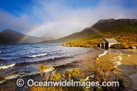 Rainbow over Dove lake and the Dove Lake boat shed. Cradle Mountain, Lake St Clair National Park, Tasmania, Australia.