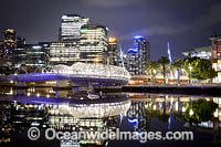 Web Bridge at dusk, a foot bridge that crosses the Yarra River at Docklands. Melbourne City, Victoria, Australia.