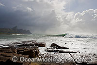 Waves breaking on shore during a storm. Cape Town, South Africa
