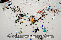 Marine pollution rubbish trash garbage comprising of small plastic pieces, washed ashore by tidal movement on a remote tropical island beach. Cocos (Keeling) Islands, Indian Ocean, Australia