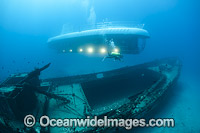 Diver exploring the wreck of the YO-257 off Waikiki Beach, Oahu, Hawaii, USA.