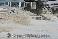 Wave breaking over house Photo - Chris and Monique Fallows