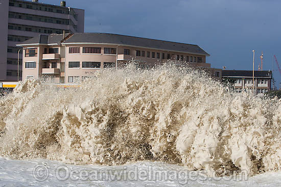 Wave breaking over house photo Wave breaking over house photo