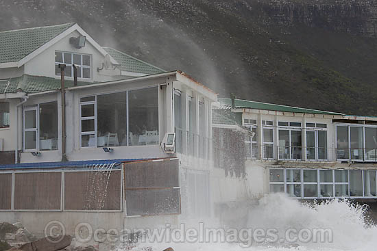 Wave breaking over house photo Wave breaking over house photo