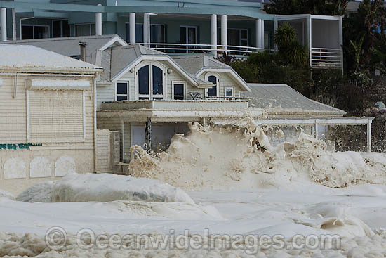 Wave breaking over wall photo Wave breaking over wall photo