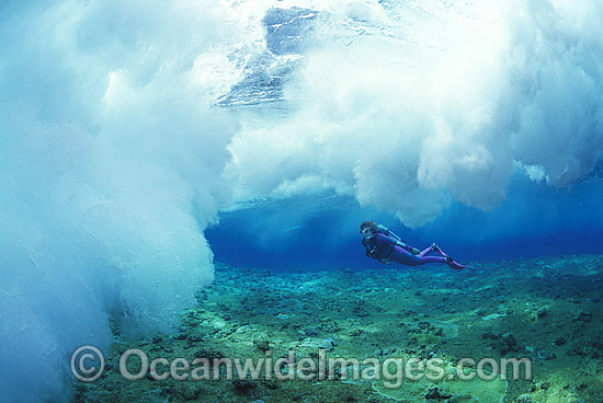 Scuba Diver breaking wave Coral reef photo Scuba Diver breaking wave Coral reef photo